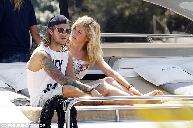 Cool dude: Dougie sported his typically laid-back attire as he teamed a white sleeveless top with baggy denim shorts and black converse trainers